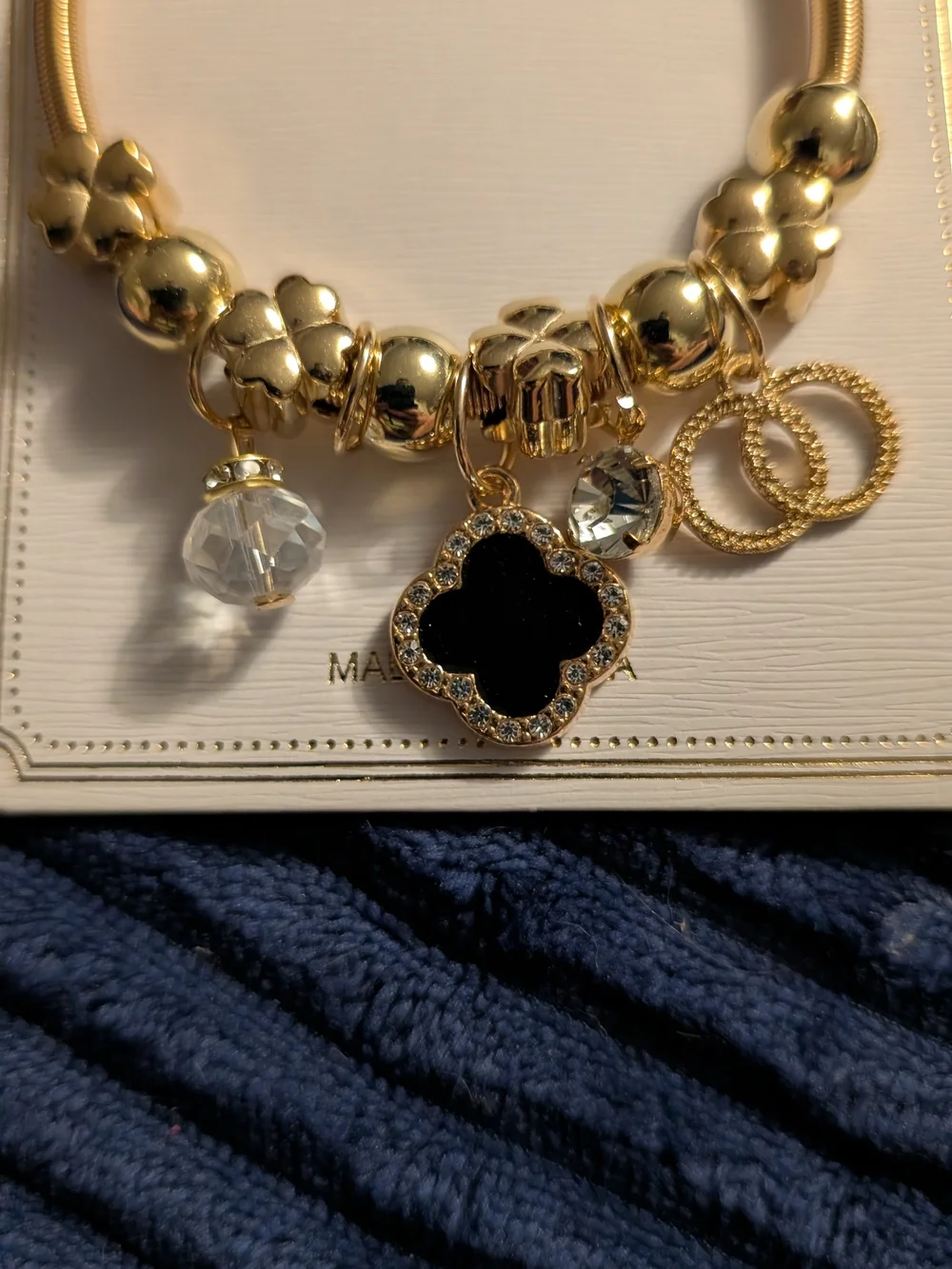 Gold Charm Bracelet with Black Clover Pendant
